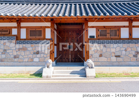 Traditional Korean Hanok Houses and Tiled Roofs against Bukhansan Mountain in Eunpyeong Hanok Village, Seoul Traditional Korean Hanok Houses and Tiled Roofs against Bukhansan Mountain in Eunpyeong Hanok Village, Seoul 143690499