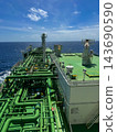 High angle view of a cargo piping system on the deck of an industrial oil tanker ship sailing in open sea. 143690590