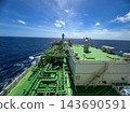 Industrial perspective shot of large chemical tanker superstructure navigating through blue ocean water 143690591