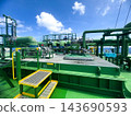 Perspective shot of specialized vessel deck equipment and emergency valves navigating through ocean. 143690593