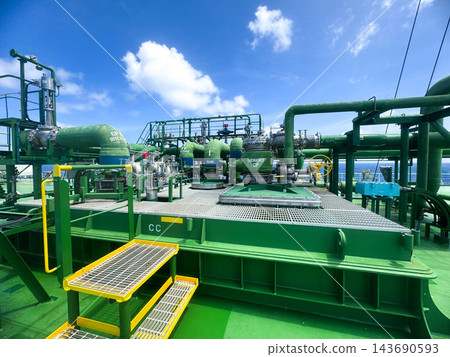 Perspective shot of specialized vessel deck equipment and emergency valves navigating through ocean. Perspective shot of specialized vessel deck equipment and emergency valves navigating through ocean. 143690593
