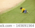 A boy playing energetically in the park 143691364