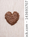 Raw flax seeds linseed heart shaped 143693707