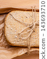 loaf of bread on backing paper 143693710