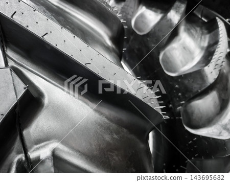 Close view of raised tread blocks on a rubber tire surface Close view of raised tread blocks on a rubber tire surface 143695682