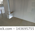 White walls and column lighting inside a modern building. 143695755