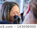 A beauty salon appointment centers on eyebrow lamination, a beautician, eyebrow tinting, brow styling, a female client, and the eyebrow area 143696000