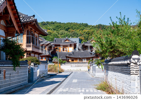 Traditional Korean Hanok Houses and Tiled Roofs against Bukhansan Mountain in Eunpyeong Hanok Village, Seoul Traditional Korean Hanok Houses and Tiled Roofs against Bukhansan Mountain in Eunpyeong Hanok Village, Seoul 143696026