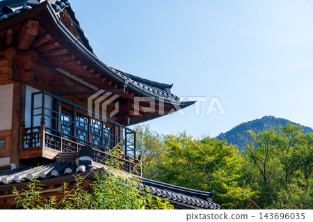 Traditional Korean Hanok Houses and Tiled Roofs against Bukhansan Mountain in Eunpyeong Hanok Village, Seoul Traditional Korean Hanok Houses and Tiled Roofs against Bukhansan Mountain in Eunpyeong Hanok Village, Seoul 143696035