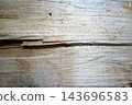 Weathered light wood plank texture with visible seam 143696583