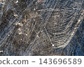 Worn concrete pavement texture with cracks, scratches, and dust 143696589