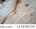 Weathered wooden board texture with wood grain and scratches 143696599