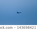 A V-22 Osprey flying through the blue sky 143698421