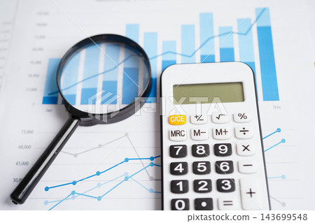 Calculator on chart graph paper. Finance, account, statistic, investment data economy, stock exchange business. Calculator on chart graph paper. Finance, account, statistic, investment data economy, stock exchange business. 143699548