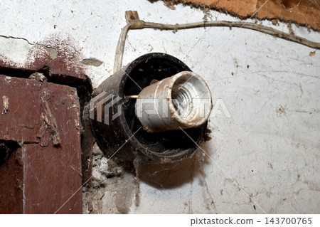 Old ceramic electric lamp socket. Old ceramic electric lamp socket. 143700765