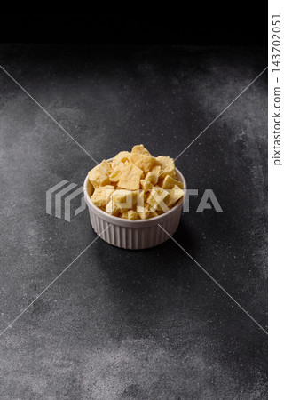 White cocoa butter chunks, used as an ingredient for making chocolate and sweets White cocoa butter chunks, used as an ingredient for making chocolate and sweets 143702051