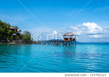 Wooden jetty on Bolilanga Island, Togian archipelago, Sulawesi, Indonesia Wooden jetty on Bolilanga Island, Togian archipelago, Sulawesi, Indonesia 143702221