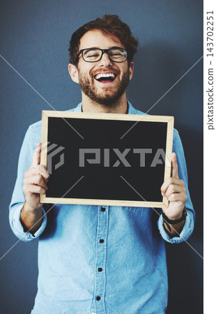Happy, man and teacher with chalkboard for mockup space with marketing, promotion or advertising. Laugh, glasses and male educator from Canada with sign for education isolated by studio background. Happy, man and teacher with chalkboard for mockup space with marketing, promotion or advertising. Laugh, glasses and male educator from Canada with sign for education isolated by studio background. 143702251