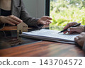 Real estate agent presenting and approved home loan contract. Real estate investment, Home mortgage concept 143704572