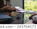 Real estate agent presenting and approved home loan contract. Real estate investment, Home mortgage concept 143704573
