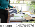 A sales representative presenting solar and wind power, alternative energy, clean energy for future. 143704576