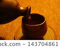 Bizen ware sake bottle and sake cup 143704861