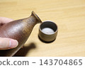 Bizen ware sake bottle and sake cup 143704865