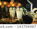 Holiday Cream Liqueur Drinks with Christmas Decorations and Bokeh 143704987