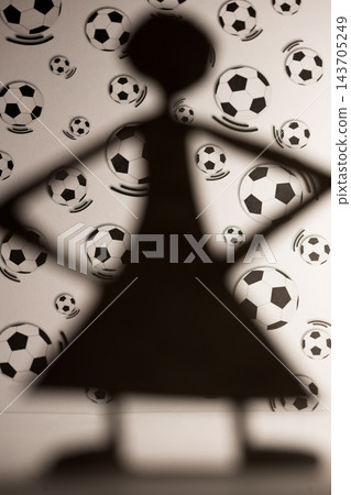 Soccer Fan Silhouette Against Football Pattern Background Soccer Fan Silhouette Against Football Pattern Background 143705249