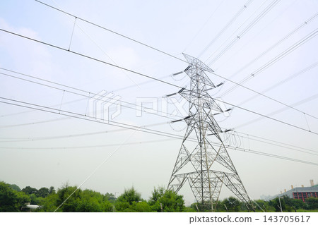High Voltage Power Transmission Tower and Electric Grid Lines High Voltage Power Transmission Tower and Electric Grid Lines 143705617
