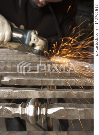 Metal Grinding Sparks in Industrial Workshop 143705618