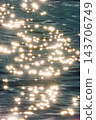 the magical glare of the sun on the surface of the water, Glowing endless calm water surface ripple smooth river at sunset 143706749