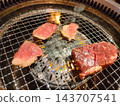 Grilled thick-cut meat and kalbi over an open flame. 143707541