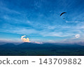 Kumamoto Prefecture: Aso Daikanbo and hang gliders soaring through the sky. 143709882