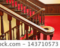 The imposing staircase and red carpet of the historic building 143710573