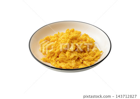 Scrambled eggs in a white plate isolated on a white background. Close-up of cooked yellow scrambled eggs, a healthy 143712827