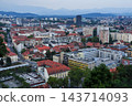 A town with red roofs overlooking the streets and market square. 143714093