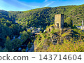 Beautiful historic building surrounded by lush greenery 143714604