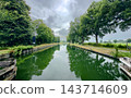 Calm waterway scene, Engineered water channel with horizon view 143714609