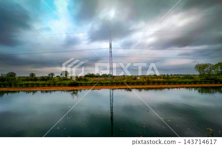 Pastoral view features water display and infrastructure present Pastoral view features water display and infrastructure present 143714617