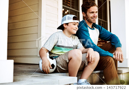 Outdoor, ball and father with child on porch in home ready for playing soccer, sports and fun on weekend. Family, happy parent and dad with young boy talking, in conversation and relax for bonding Outdoor, ball and father with child on porch in home ready for playing soccer, sports and fun on weekend. Family, happy parent and dad with young boy talking, in conversation and relax for bonding 143717922