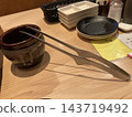 Grilling tongs and pot 143719492