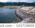 A massive seawall protects the town from tsunamis (Sanriku region) 143719609
