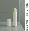 Open lip balm stick mockup with a lid in sage green bathroom. Herbal cosmetic product for daily use 143720029