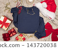 Blank dark blue folded sweatshirt mockup near Christmas decor, copy space. Holiday apparel flat lay 143720038