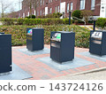 Underground waste containers for recycling in residential area. 143724126
