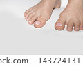 Female feet with neat pedicure and copyspace 143724131