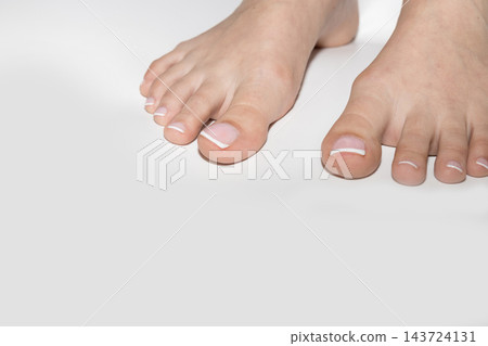 Female feet with neat pedicure and copyspace 143724131
