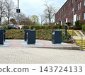 Underground waste containers for recycling in residential area. 143724133