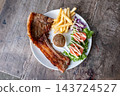 Grilled Pork Chop with French Fries and Salad 143724527